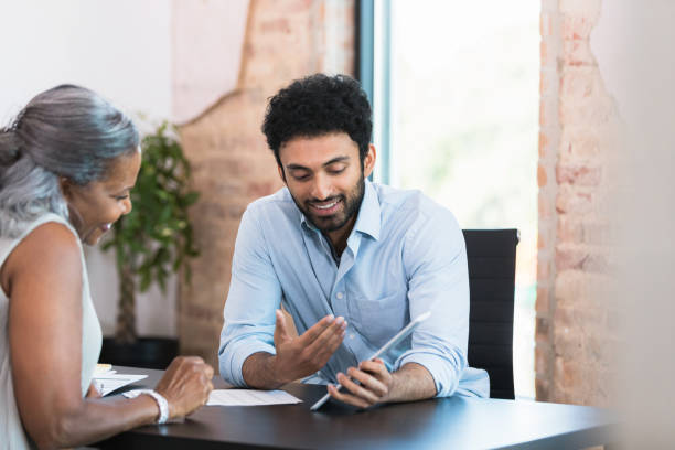 istock Financial advisor meets with female client 1354411953
