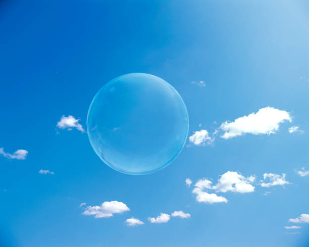 istock Soap bubbles bright sun and sky realistic background 1354412038