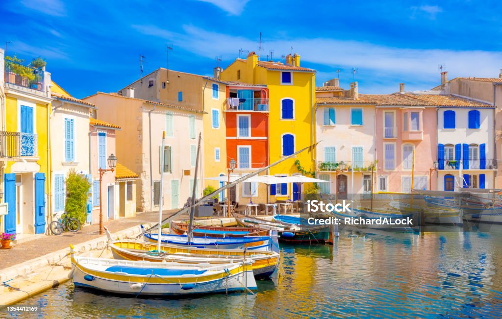 Martigues, Provence, France Brightly coloured houses in the traditional streets and famous old harbour of Martigues, Provence, South of France Marseille Stock Photo