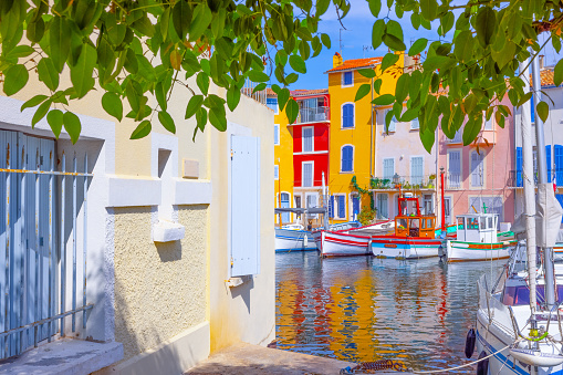 Brightly coloured houses in the traditional streets and famous old harbour of Martigues, Provence, South of France