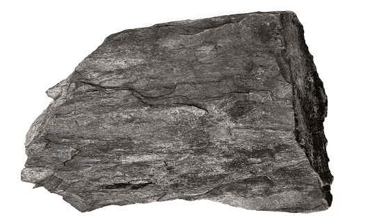 Piedra de piedra caliza y esquisto aislada sobre fondo blanco. Vista superior de esquisto de piedra plana. photo