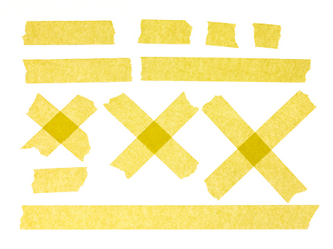 Strips of yellow masking tape on white background. Set of adhesive tape strips and crosses. Painter's tape isolated on white