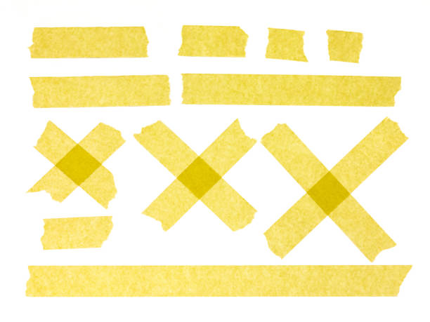 Strips of yellow masking tape on white background. Set of adhesive tape strips and crosses. Painter's tape isolated on white Strips of yellow masking tape on white background. Set of adhesive tape strips and crosses. Painter's tape isolated on white paper dispenser stock pictures, royalty-free photos & images