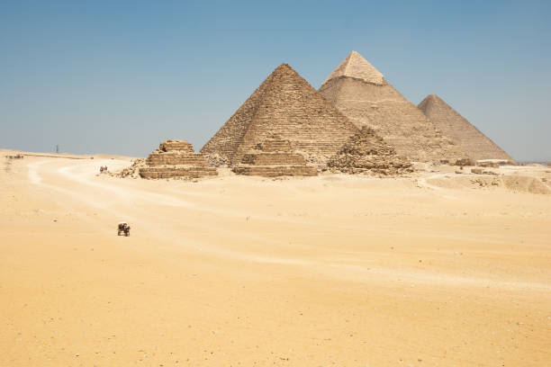 istock Horse drawn carts near Giza pyramids. 1354415382