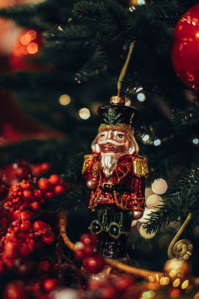 istock Christmas toy Nutcracker hanging on the Christmas tree. 1354419794