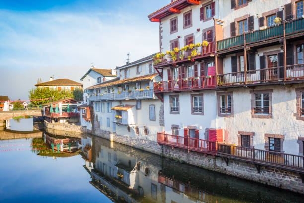 Historic houses at the Nive river in Saint-Jean-Pied-de-Port Historic houses at the Nive river in Saint-Jean-Pied-de-Port, France saint jean pied de port stock pictures, royalty-free photos & images