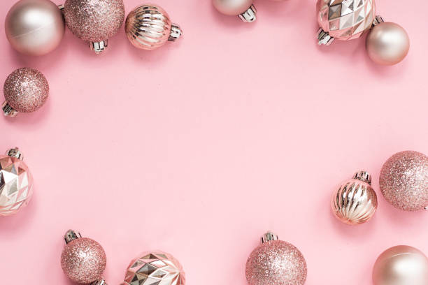 istock Decorative Christmas balls, empty space for text on a pink background. Top view, flat lay. 1354421483