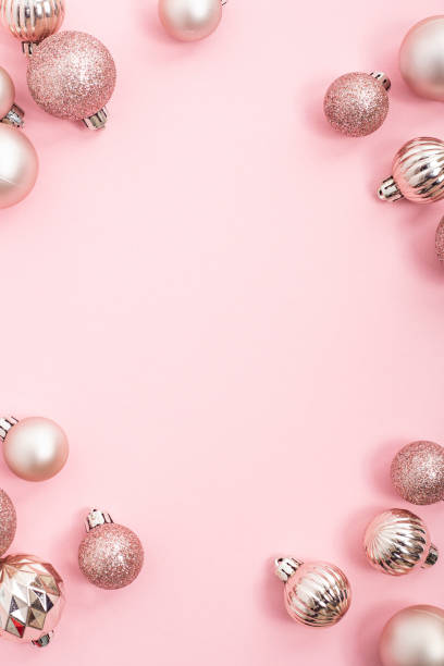 istock Decorative pink shiny balls, place for text on a pink background. Top view, flat lay. 1354421759