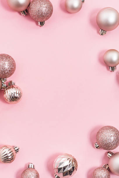istock Decorative Christmas balls, empty space for text on a pink background. Top view, flat lay. 1354421810