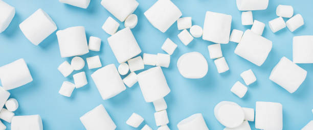 istock White marshmallows on a blue background. Top view, flat lay. Banner. 1354421848