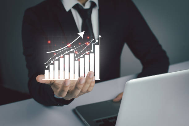 istock Business people are using Stock chart innovative technology. Mixed media, digital smartphone and online shopping concept. 1354424013