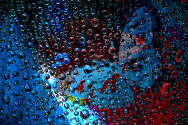 istock Red-blue spheres are located against the multicolored background with blue silhouette of butterfly. 1354424991