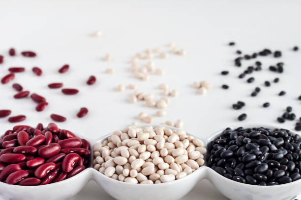 istock Assortment of beans in a white bowl on white background 1354428809