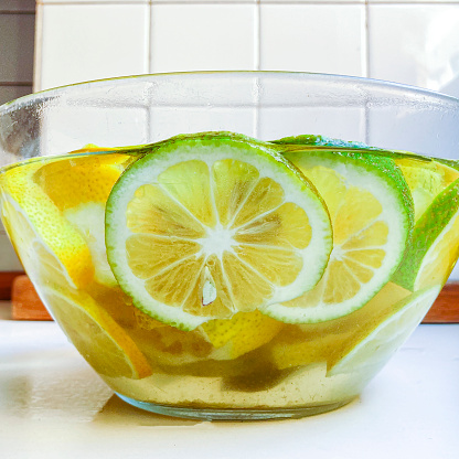 High angle view of slice of lemon in water for 24 hours .The process of making lemon jam.
