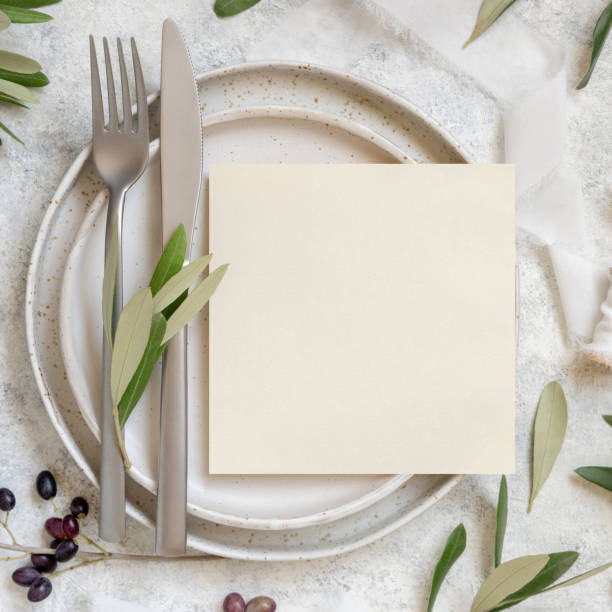 istock Wedding Table place with a card decorated with olive branches 1354434816