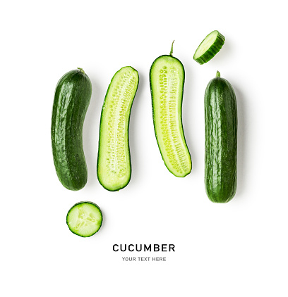 Cucumber creative layout and composition isolated on white background. Food, healthy eating and dieting concept. Fresh vegetables arrangement. Flat lay, top view. Design element