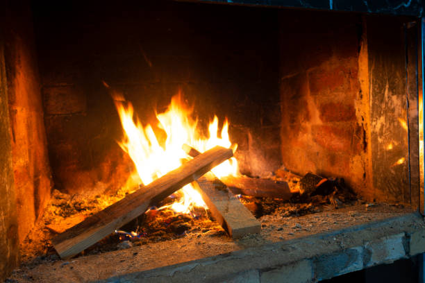 istock Burning Logs In Flame Close Up 1354438240