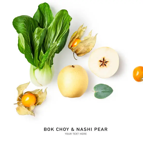 Bok choy, nashi pear and physalis berry creative layout isolated on white background. Healthy eating and dieting food concept. Tropical fruits and vegetables concept. Top view, flat lay