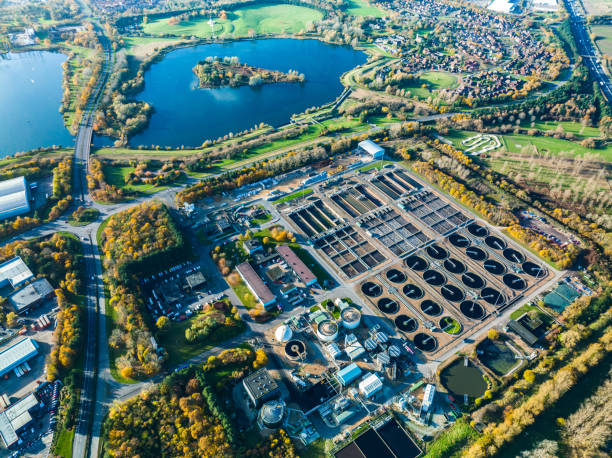 Aerial photo of purification tanks of modern wastewater treatment plant Aerial photo of purification tanks of modern wastewater treatment plant sewage treatment plant stock pictures, royalty-free photos & images