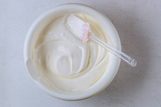 istock Homemade vanilla whipped cream in a white bowl. 1354439530