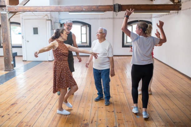 istock Group of happy Caucasian seniors having fun after dance class 1354439586