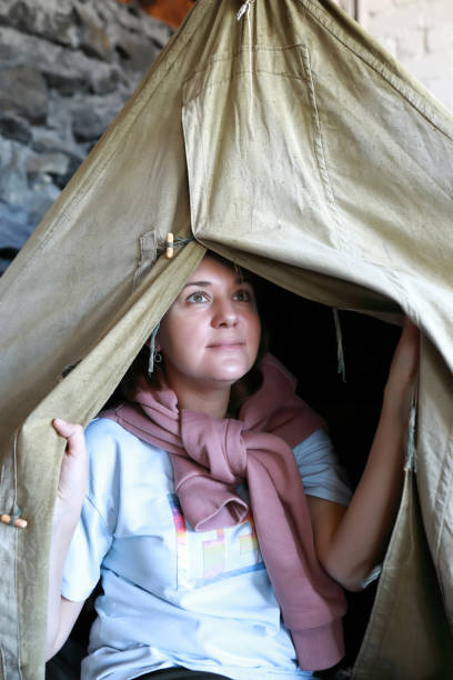 istock Woman posing in vintage tent 1354441777