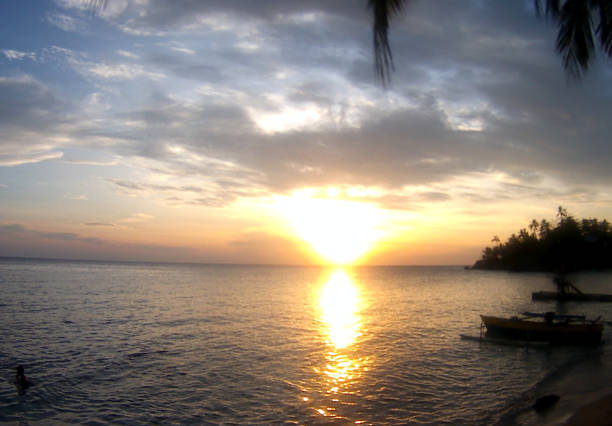 istock sunset on Gorontalo beach, Indonesia 1354443707