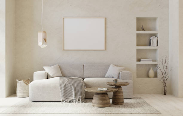 istock Warm, beige colors interior with sofa, round coffee tables and picture mockup. 3D render. 1354445053