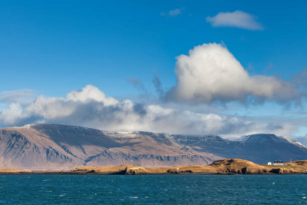 coastline and mountain ridge near reykjavik in iceland.