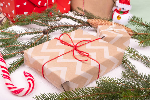 istock christmas gift boxes with decorative paper and spruce branch 1354449228