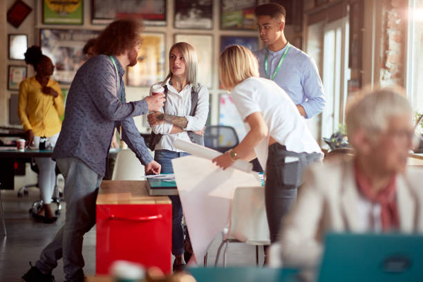 istock Young colleagues in the office are discussing about project they working together on 1354459506