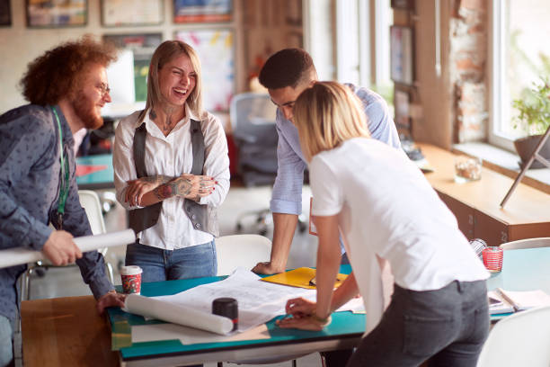 istock Young colleagues in the office are enjoying to work on a project together 1354460059