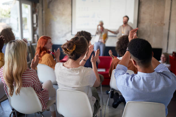 istock A group of young creative people is satisfactorily applauding the well-held presentation in the office 1354461772