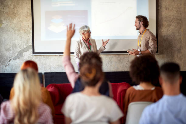 istock Senior colleagues holding a presentation 1354461828