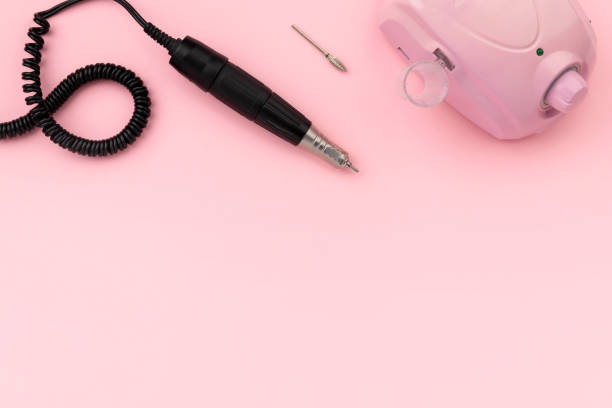 istock Flat lay top view equipment for manicure on pink background 1354468442