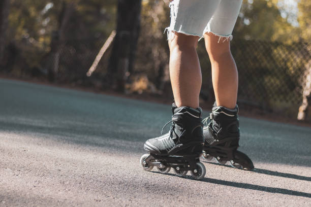 istock a young man skating with inline skates on a mountain road. 1354470162