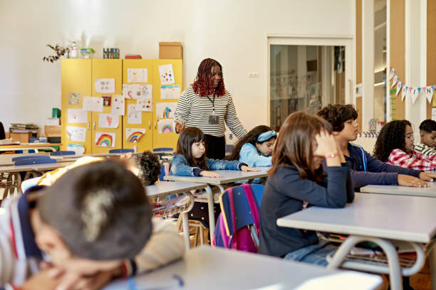 istock Schoolchildren Enjoying Rest Time in Classroom 1354472023