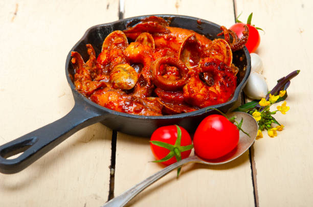 istock fresh seafoos stew on an iron skillet 1354475251