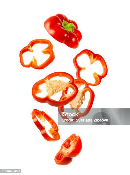Levitation Of Red Bell Pepper Isolated On White Background Stock Photo - Download Image Now