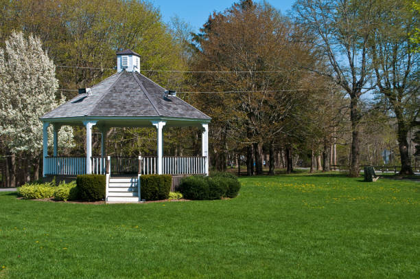 white wedding gazebo on the shore of the lake