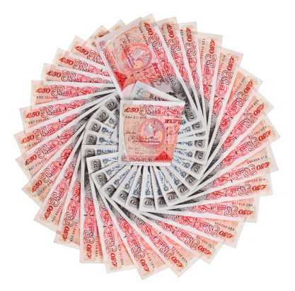 Many 50 pound sterling bank notes fanned out, isolated on white