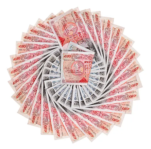 Photo of Many 50 pound sterling bank notes fanned out, isolated