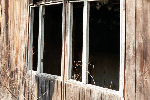 istock Vintage wooden window frame with broken glass 1354480155