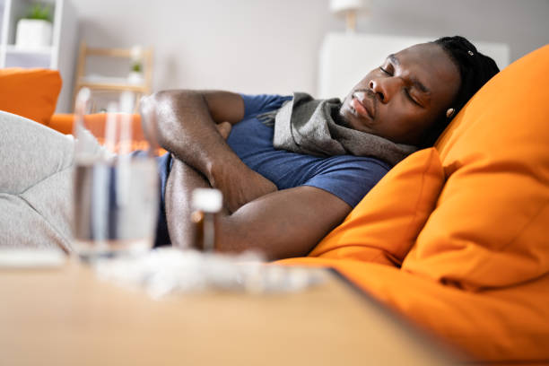 istock Sick African American Man On Sofa 1354481535