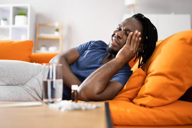 istock Tired African American Man With Headache 1354481557