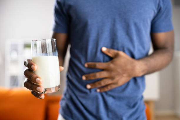 African Male Refusing Milk African Male Refusing Milk. Dairy Food Allergy lactose fermentation stock pictures, royalty-free photos & images