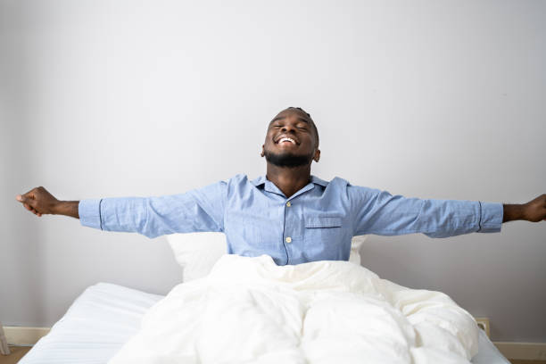 istock Young Happy Smiling African Man Waking Up 1354481615
