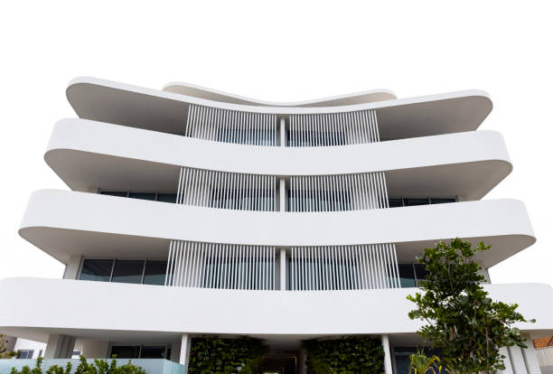 istock New, modern apartment building, front view, white background with copy space 1354481924