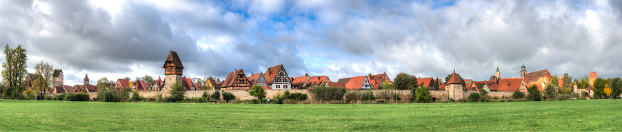 Panoramic view of the old town of Dinkelsbühl in Franconia against a dramatic sky
