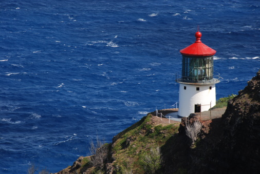 Lovely Makapuu Lightouse with deep blue oceanic water in the background